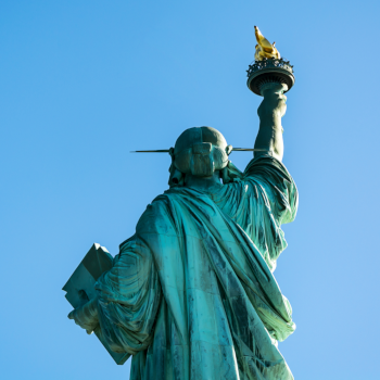 The Statue of Liberty shown from behind, representing financial freedom
